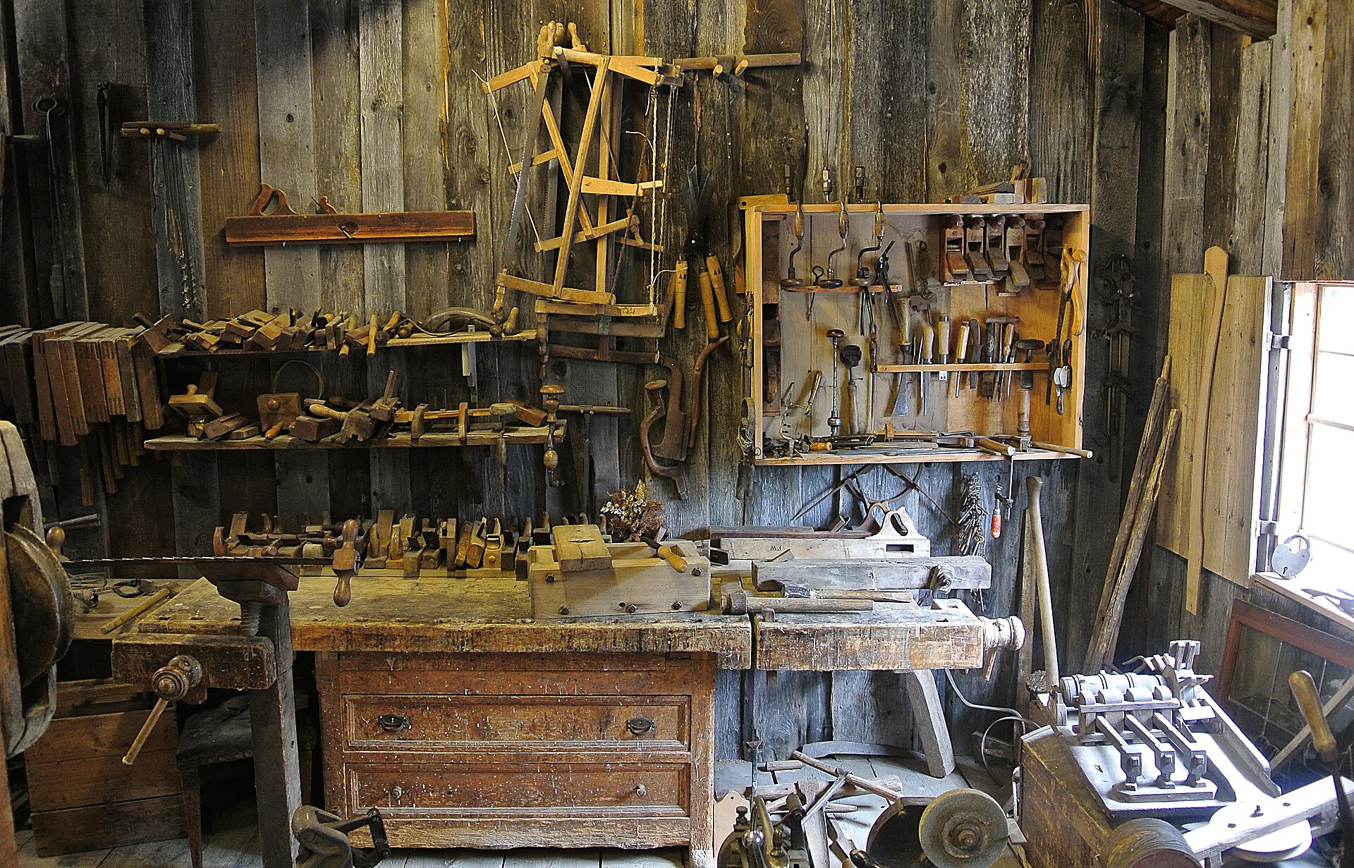 Woodworking shop bench with hand tools